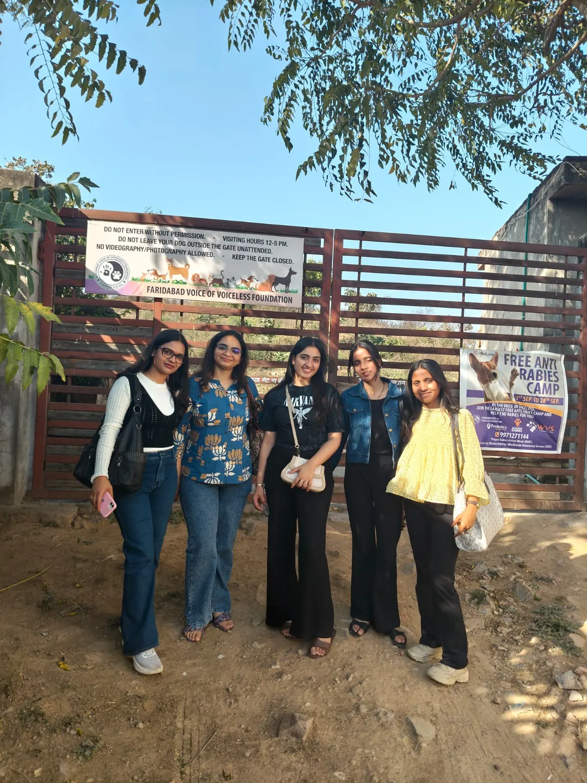 Volunteers at the VoV shelter gate